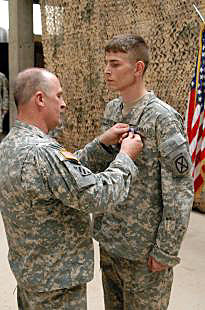 SSG Anthony Skirko receives Soldiers Medal from Maj. Gen. Rick Lynch